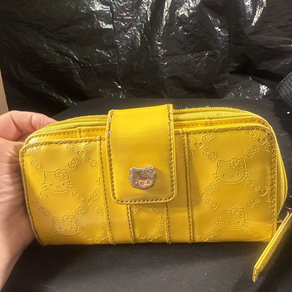 Vintage 2013 Loungefly Sanrio Hello Kitty yellow embossed patent leather wallet.